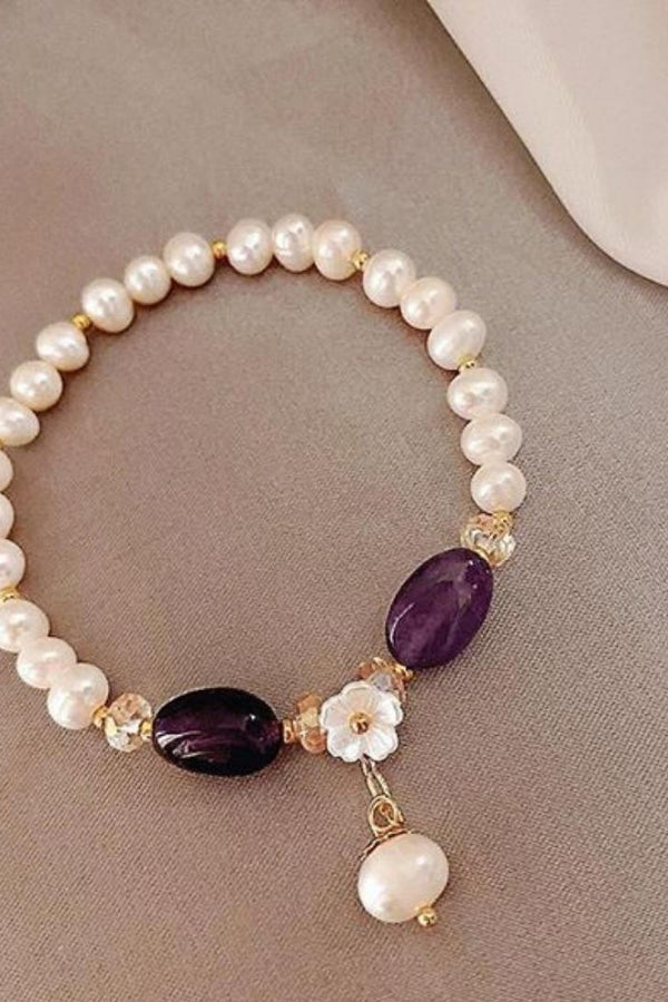 Gold Pearl Bracelet Featuring a Purple Gemstone