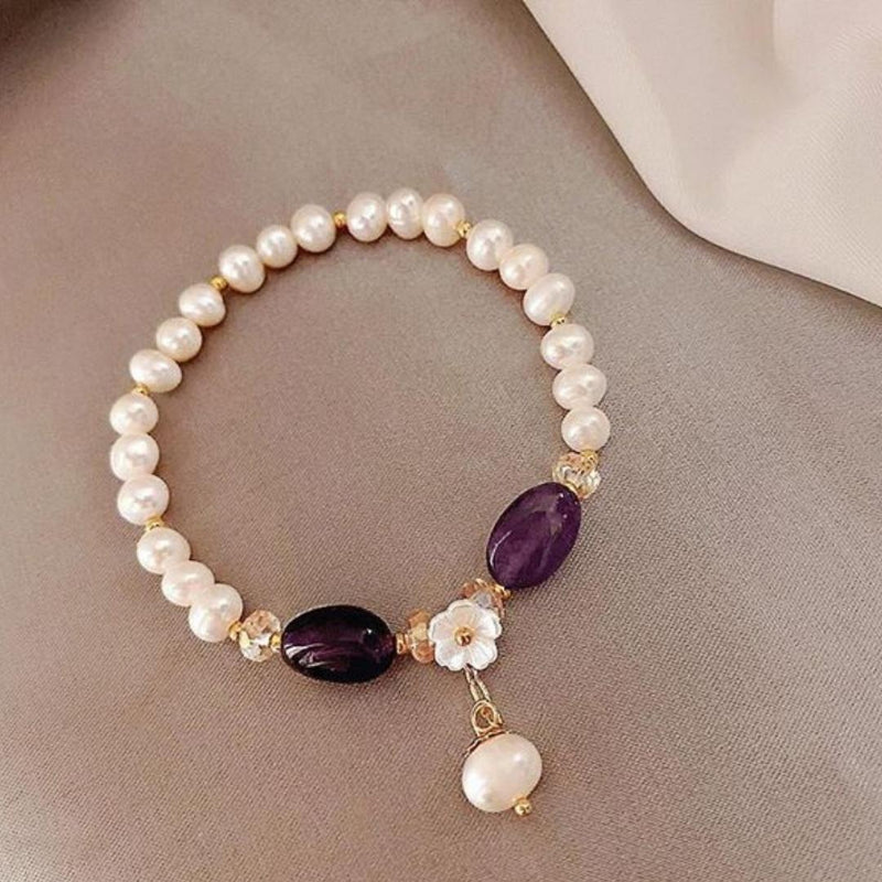 Gold Pearl Bracelet Featuring a Purple Gemstone