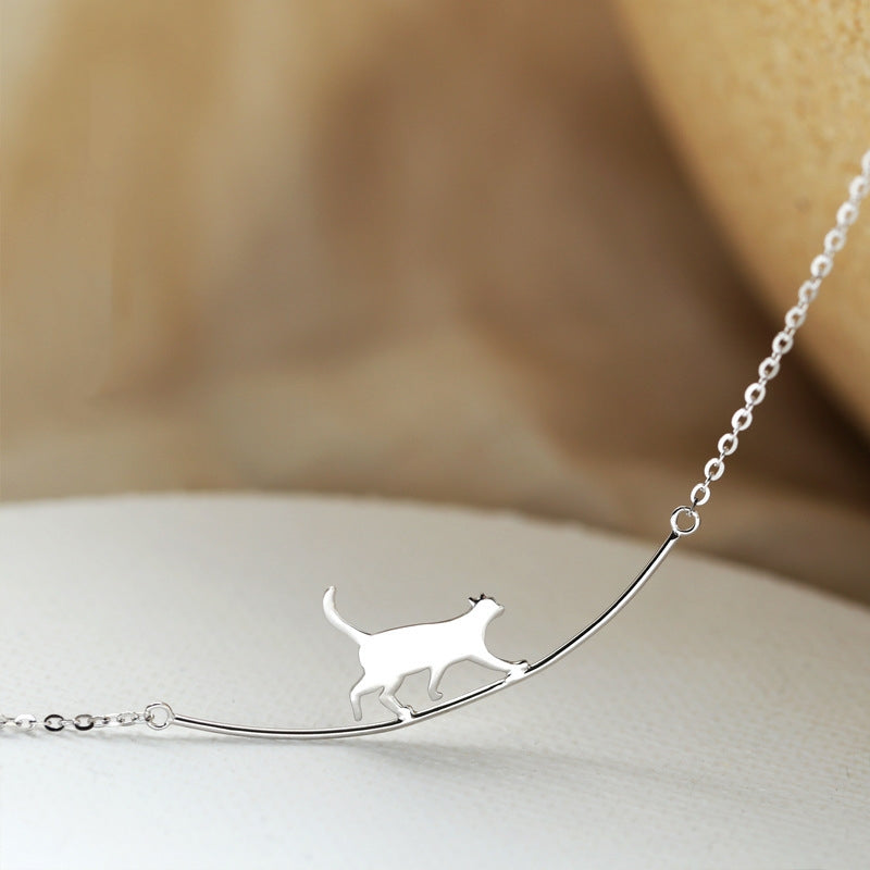 Silver Pendant Necklace Featuring a Playful Kitten