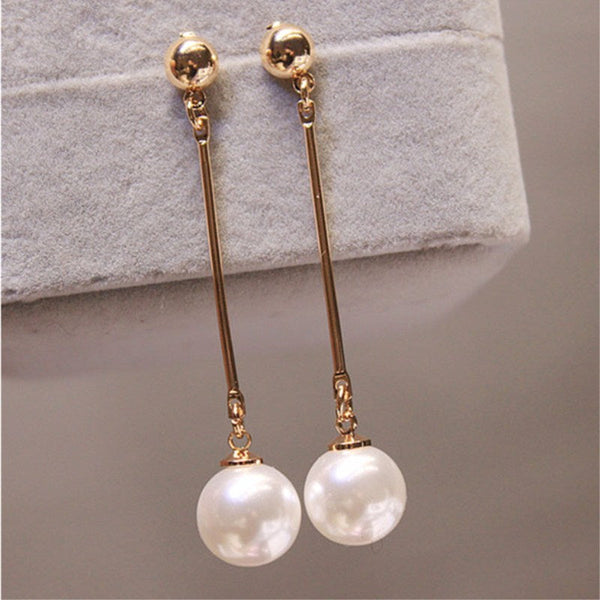 Elegant Dangle Earrings Featuring Unique Handcrafted Pearls