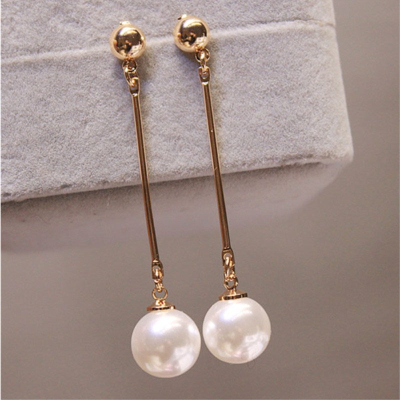 Elegant Dangle Earrings Featuring Unique Handcrafted Pearls