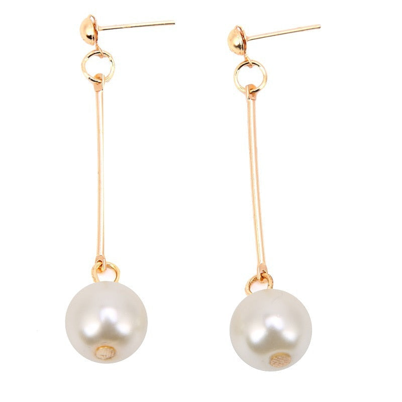 Elegant Dangle Earrings Featuring Unique Handcrafted Pearls