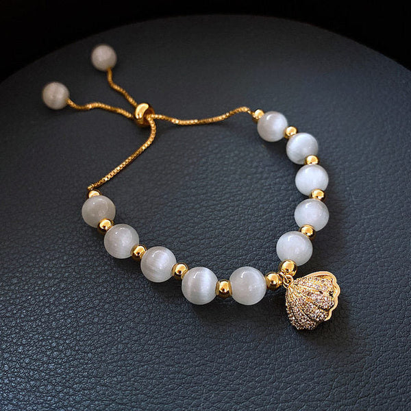 Gold Pearl-Accented Shell Bracelet