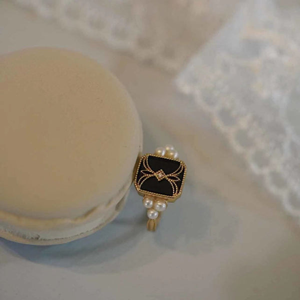 Gold Adjustable Black Enamel Ring Adorned with Pearls