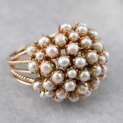 Ruby Ring Featuring Integrated Pearls