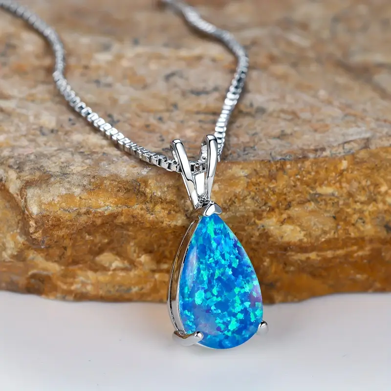 Silver Necklace Featuring Teardrop Blue Opal